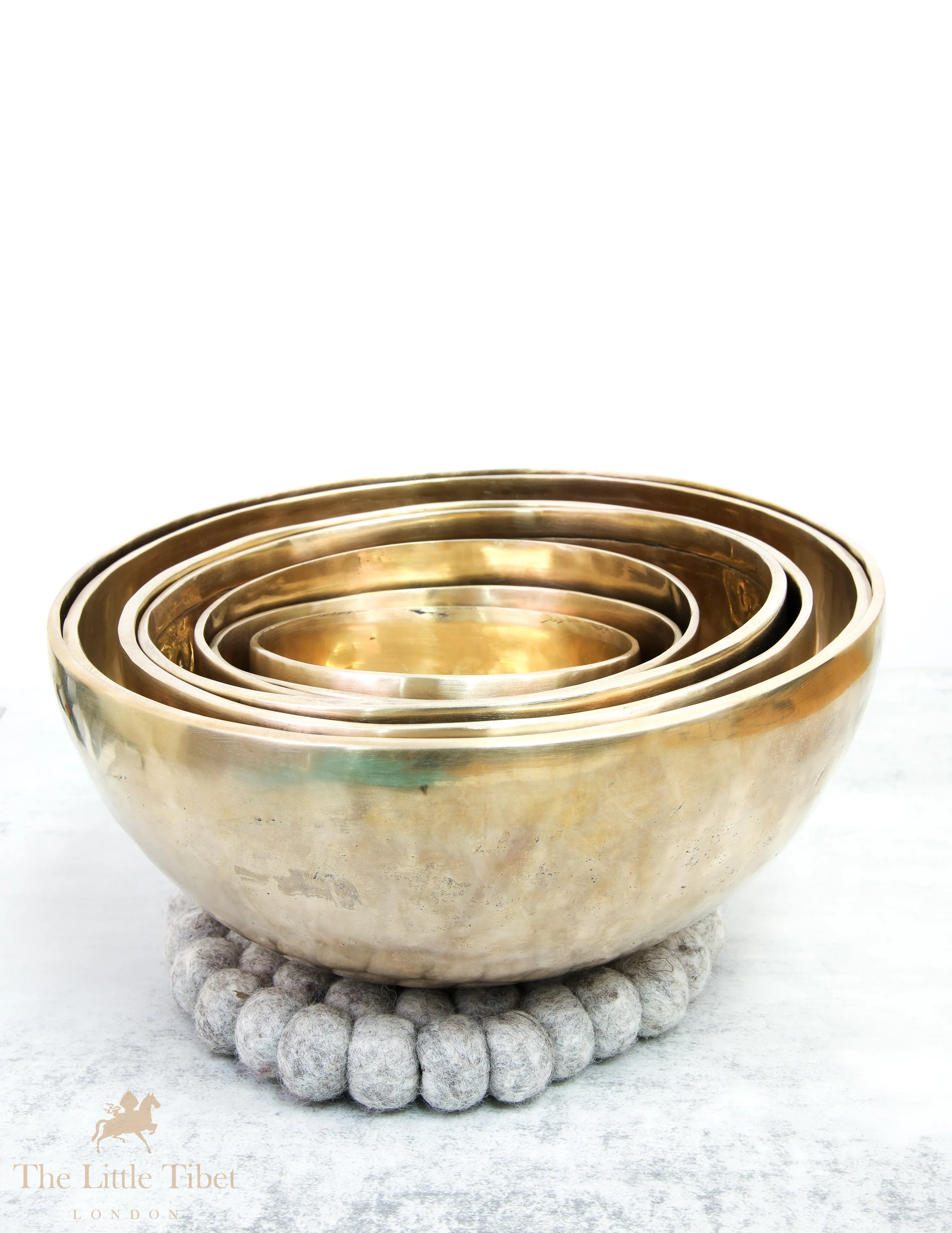 Discover Balance and Harmony with the Nestling Seven Chakra Tibetan Singing Bowl Set- Plain 7 Chakra Set