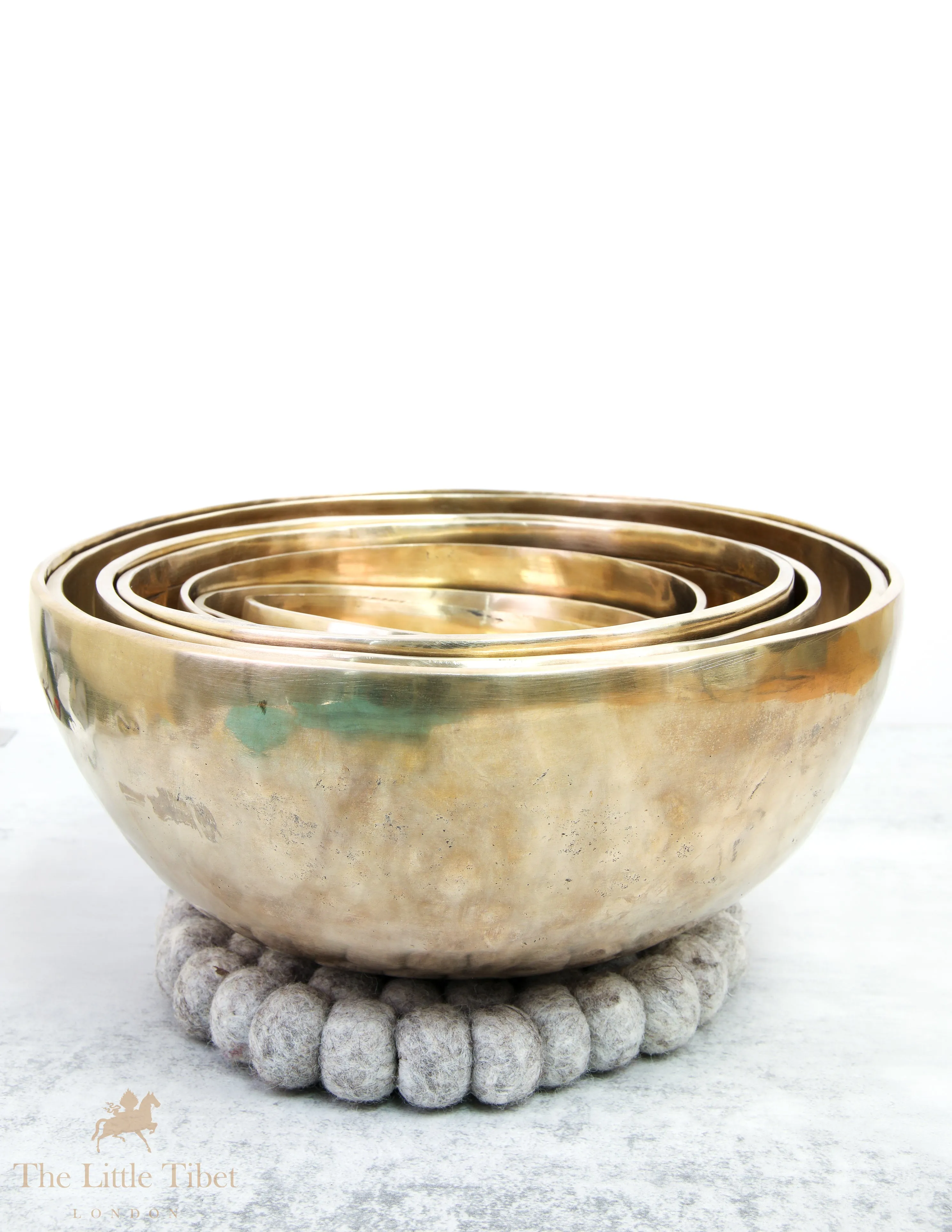 Discover Balance and Harmony with the Nestling Seven Chakra Tibetan Singing Bowl Set- Plain 7 Chakra Set