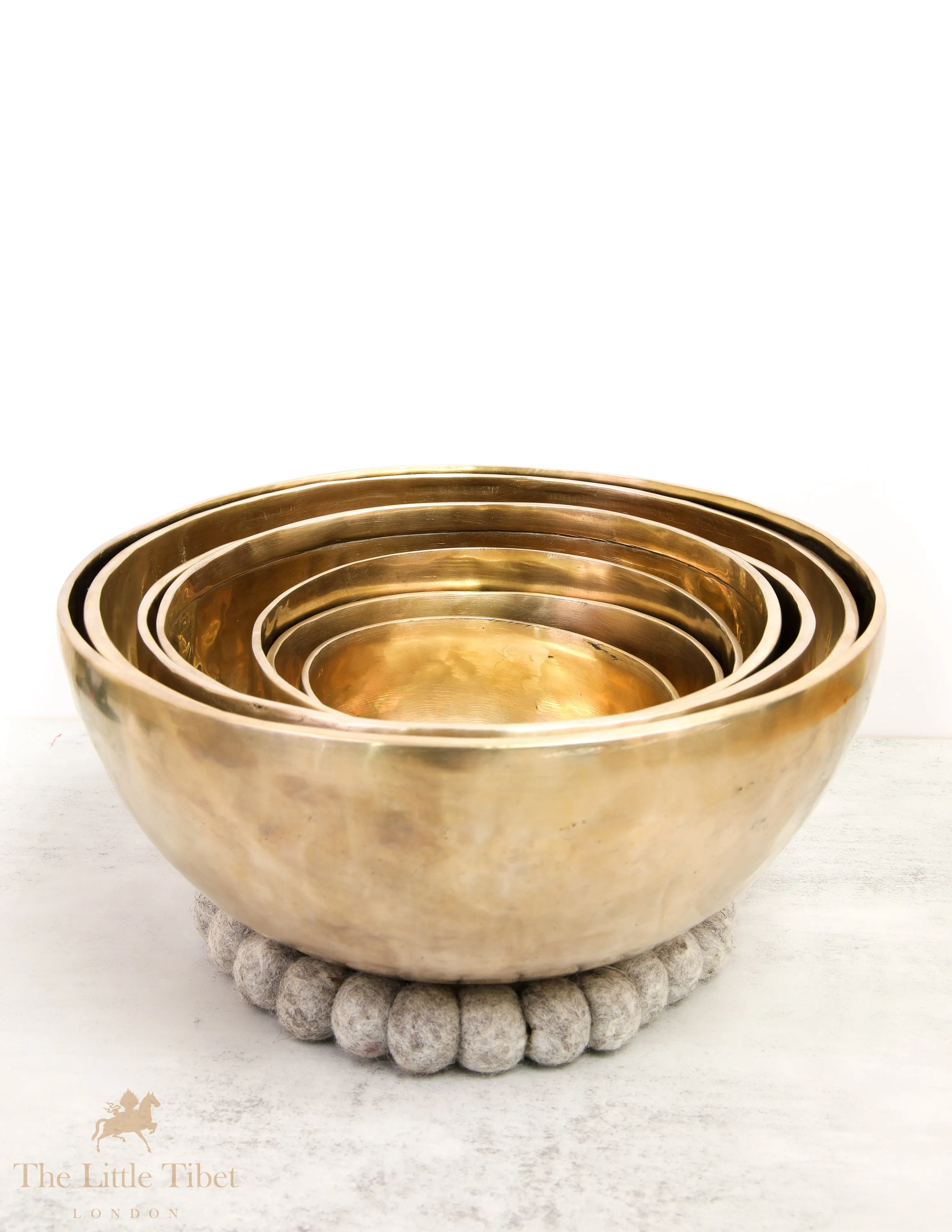 Discover Balance and Harmony with the Nestling Seven Chakra Tibetan Singing Bowl Set- Plain 7 Chakra Set